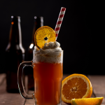 Beer Float topped with a dried orange wheel